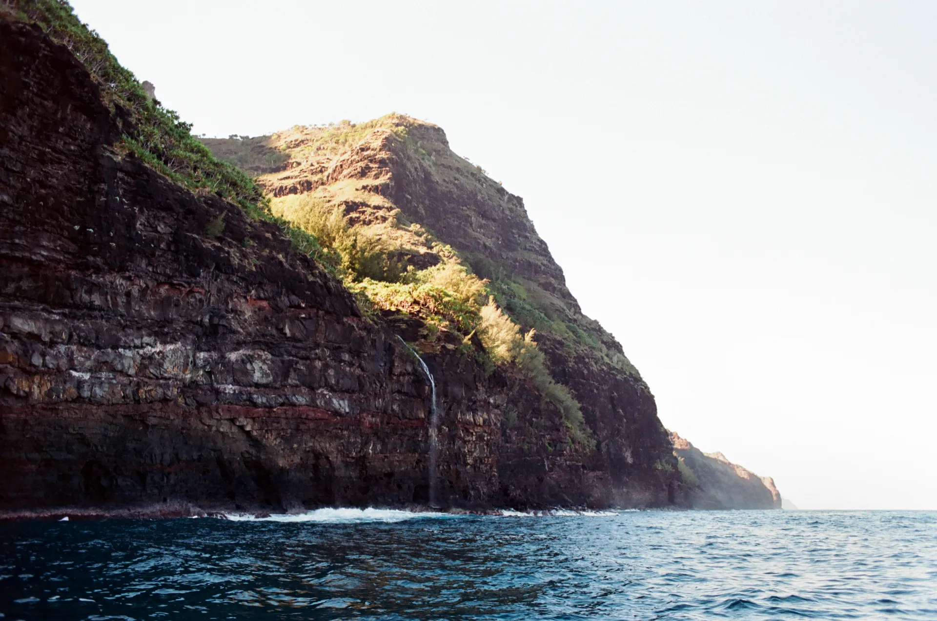 Waterfall cascading down a coastal cliff